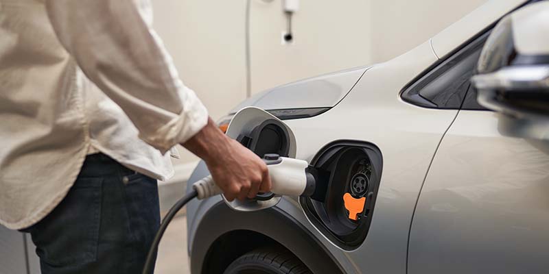 man charging bolt EV