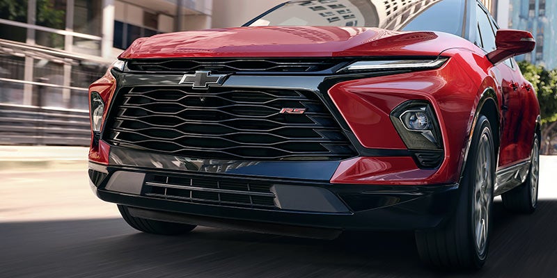 right side view of red chevy blazer